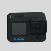 Action-Kamera Action-Kamera vor hellem Hintergrund