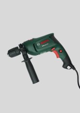 Schlagbohrmaschine vor hellem Hintergrund