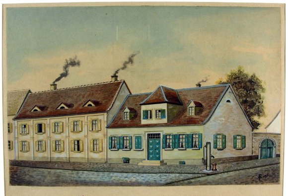 Bild mit mehreren Gebäuden an einer Straße