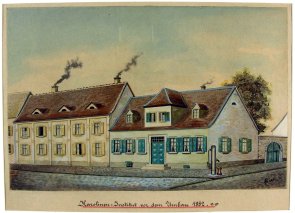 Bild mit mehreren Gebäuden an einer Straße