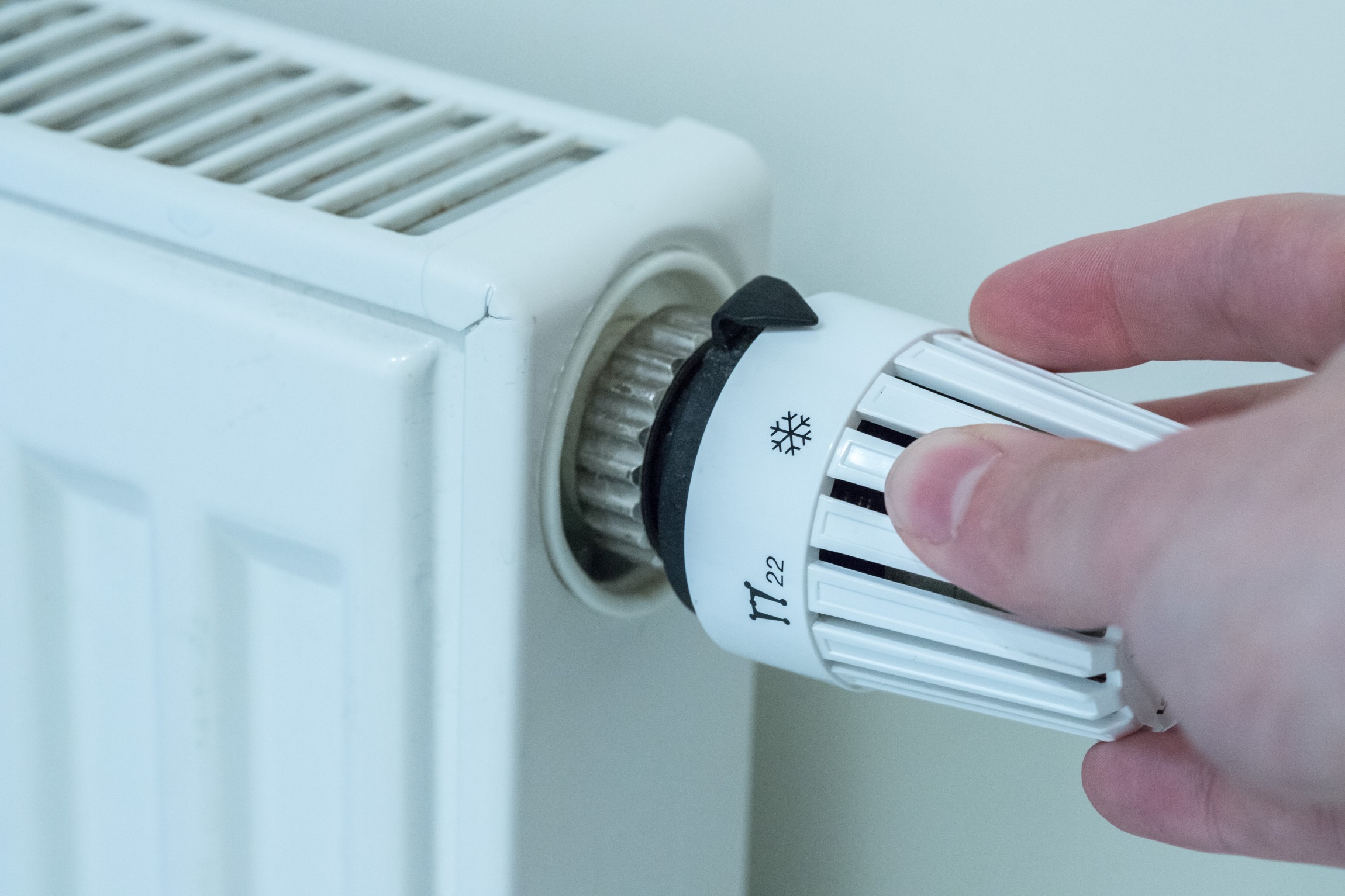 Heat regulator on a heater, close up picture. Heating Costs. Heizungsthermostat