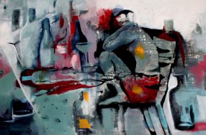 Zu sehen ist ein Mensch, der auf einem Stuhl sitzt. 